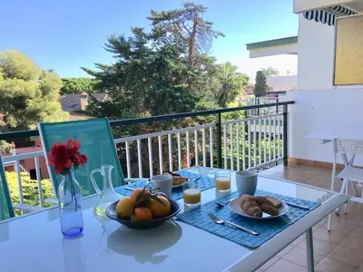 a table with a bowl of fruit on a balcony at Apartamento La Mediterránea a 100 metros de la playa - Vilanova i la Geltrú - ES-332-1 in Vilanova i la Geltrú