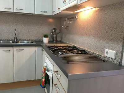 a kitchen with a stove and a sink at Apartamento La Mediterránea a 100 metros de la playa - Vilanova i la Geltrú - ES-332-1 in Vilanova i la Geltrú