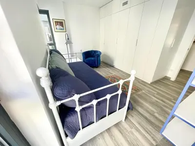 a bedroom with a bed with purple sheets at Apartamento Confortable con Parking Privado en el Centro de Vilanova i la Geltrú - ES-332-8 in Vilanova i la Geltrú