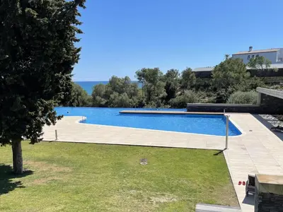 a swimming pool with a view of the ocean at Casa espaciosa con piscina, aire acondicionado y jardín cerca de la playa de Vilanova - ES-332-9 in Sant Pere de Ribes