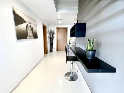 a kitchen with a black counter and a plant on a wall at Casa espaciosa con piscina, aire acondicionado y jardín cerca de la playa de Vilanova - ES-332-9 in Sant Pere de Ribes