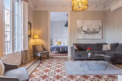 a living room with a couch and a table at Flateli Universitat in Barcelona