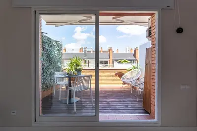 a view of a patio with a table and chairs at Penthouse with private terrace in the center in Barcelona