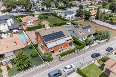 an aerial view of a house with solar panels on the roof at Casa de vacances Mary in Santa Eulalia de Ronsaná