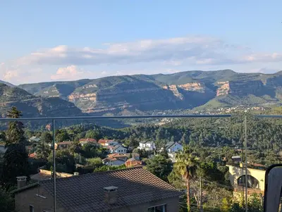 a view of a town with mountains in the background at AranEtxea in Bigues i Riells