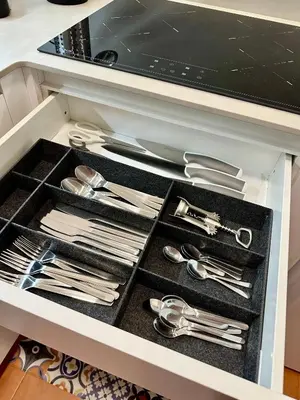 a drawer filled with silver utensils in a kitchen at Apartamento St Agustí - Centric in Mataró
