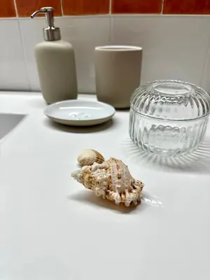 a piece of food on a counter next to a bowl at Apartamento St Agustí - Centric in Mataró