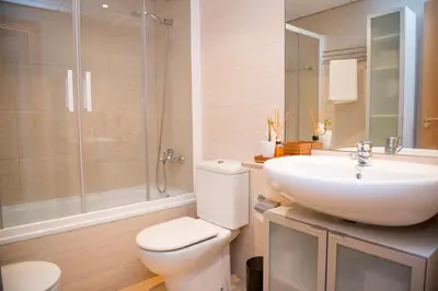a bathroom with a toilet and a sink and a shower at Opening Doors Pueblonuevo in Barcelona
