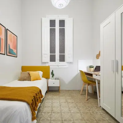 a bedroom with a bed and a desk at Girona 46 - 1 in Barcelona