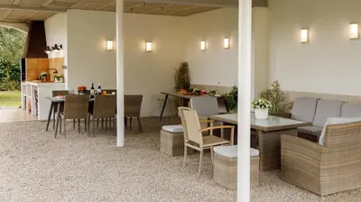 a kitchen and dining room with a table and chairs at Casa Fontanals in Pla del Panadés