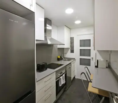 a kitchen with a sink and a stove top oven at Sagrada Familia - The Haus Bcn in Barcelona