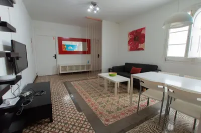 a living room with a couch and a table at Barcelona Classic Eixample Apartments in Barcelona