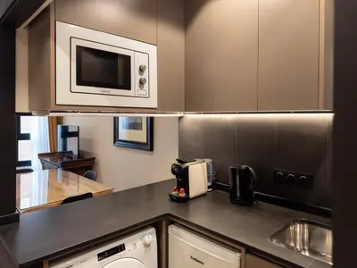 a kitchen with a microwave oven and a stove at Stay U-nique Apartment Putxet II in Barcelona