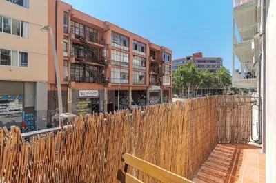 a wooden fence in front of a building at GuestReady - Lovely home in the heart of Barcelona in Barcelona