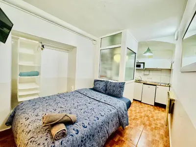 a bedroom with a bed with a towel on it at O43 Center Barça 4 3 in Barcelona