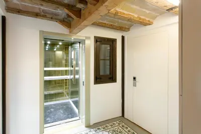 a hallway with a door and a window at Barcelona Classic Palau Apartments in Barcelona
