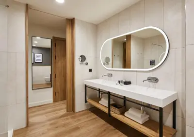 a bathroom with a sink and a mirror at Four Points by Sheraton Barcelona Airport in Barcelona