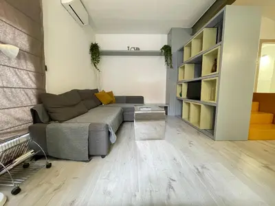 a room with a large wooden cabinet in the corner at Duplex in Gracia in Barcelona