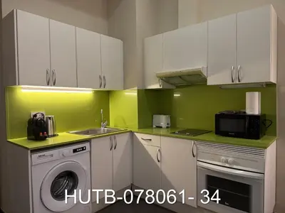 a kitchen with a washing machine and a sink at Palau de la música 1 in Barcelona