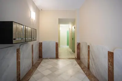 a room with a corridor with chairs in it at Palau de la música 1 in Barcelona