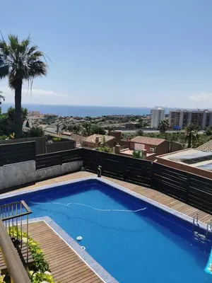 a swimming pool on the roof of a building at Apartamento con piscina y barbacoa cerca de Barcelona in Teià