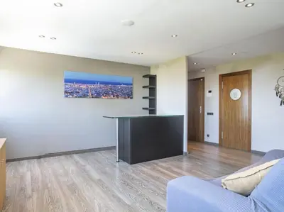 a living room with a flat screen tv and a couch at Apartamento temporal en Barcelona in Barcelona