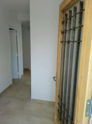 an open door to a room with a hallway at Alt Penedes, terra de vinya, sol, aigua i muntanya in Torrellas de Foix