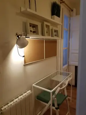 a glass table and a chair in a room at Apart 2 bedrooms 2 bathroom 30 nigth min WiFi washmachime elevator AC heather in Barcelona