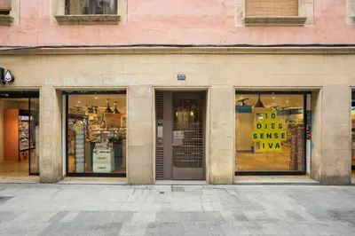 a store front with signs in the windows at Palau de la música 2 in Barcelona
