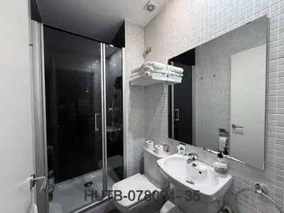 a bathroom with a toilet and a sink and a shower at Palau de la música 4 in Barcelona