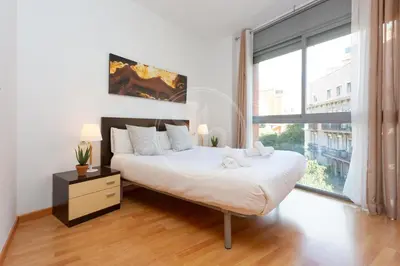 a living room with a tv and a table at Cosy Apartment next to Sagrada Familia V in Barcelona