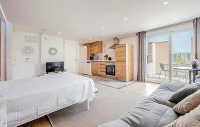 a living room with a bed and a couch at Amazing Apartment In Sant Pere De Ribes in Sant Pere de Ribes