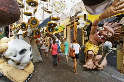 a group of people walking down a street with stuffed animals at Estudio en Barrio de Gracia E4 in Barcelona