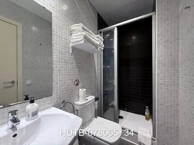 a bathroom with a toilet and a sink and a shower at Palau de la música 5 in Barcelona