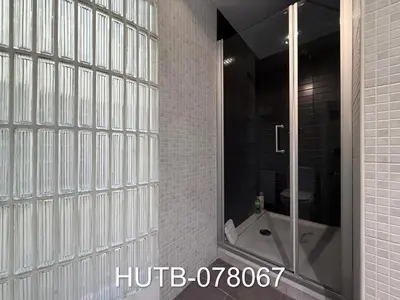 a bathroom with a shower and a toilet and a window at Palau de la música 7 in Barcelona