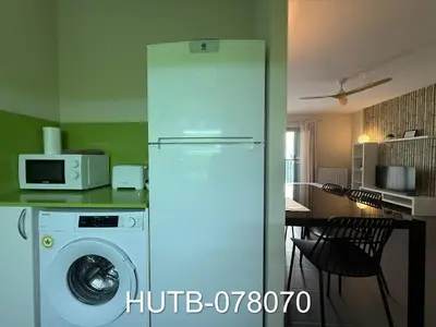 a kitchen with a refrigerator and a washing machine at Palau de la música 10 in Barcelona