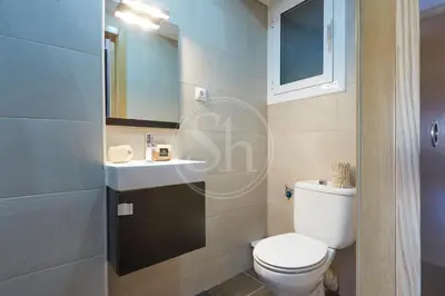 a bathroom with a toilet and a sink at Moderno Estudio en Eixample in Barcelona