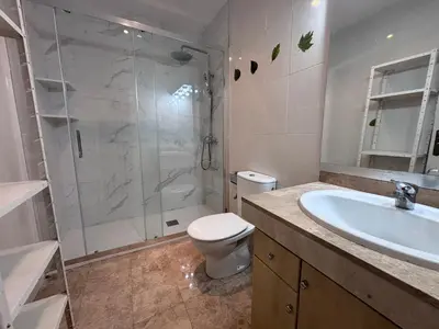 a living room with a couch and a table at Practico apartamento junto a Estación de Sants in Barcelona
