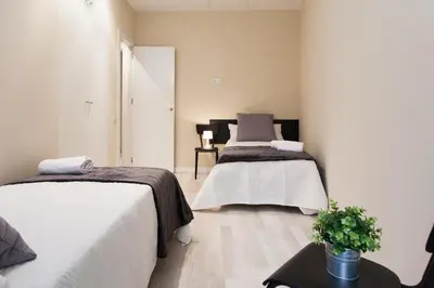 a bathroom with a white sink and a toilet at Key Plaza Cataluña Bliss in Barcelona