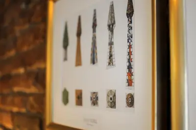 a display of ties hanging on a wall at The Sants's balcony in Barcelona