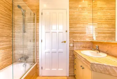 a bathroom with a sink and a shower and a tub at Villa Romady in Sant Pere de Ribes