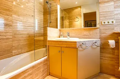 a bathroom with a sink and a shower and a tub at Villa Romady in Sant Pere de Ribes