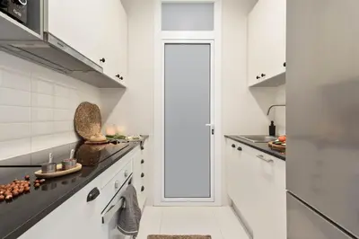 a bedroom with a bed with a table on it at Jaiz - 2 bedrooms and terrace in Eixample Esquerra in Barcelona