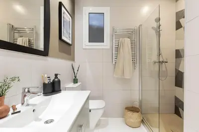a desk with a chair next to a window at Jaiz - 2 bedrooms and terrace in Eixample Esquerra in Barcelona