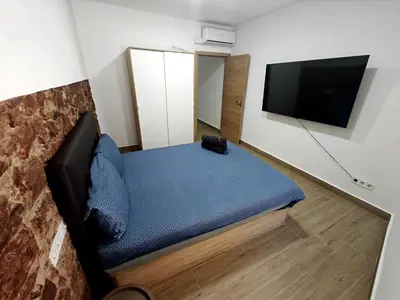 a room with a couch and a flat screen tv at Gorgeous Appartment in Martorell-Barcelona in Martorell