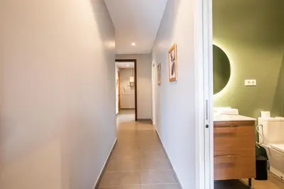 a hallway of a bathroom with a sink and a toilet at 43MAL1000-Nice&Bright 2BR flat next to Sagrada Familia in Barcelona