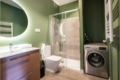 a bathroom with a washing machine and a washer at 43MAL1000-Nice&Bright 2BR flat next to Sagrada Familia in Barcelona