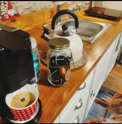 a kitchen counter with a tea kettle and a cup of coffee at La Julita in San Quírico Safaja