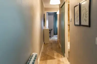 a hallway leading to a room with a hallway at BeBarceloner Vall Hebron Apartment in Barcelona