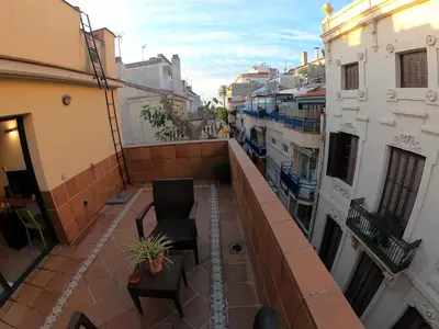 an apartment balcony with a view of a street at Sitges rooms by Sitges Apartment in Sitges